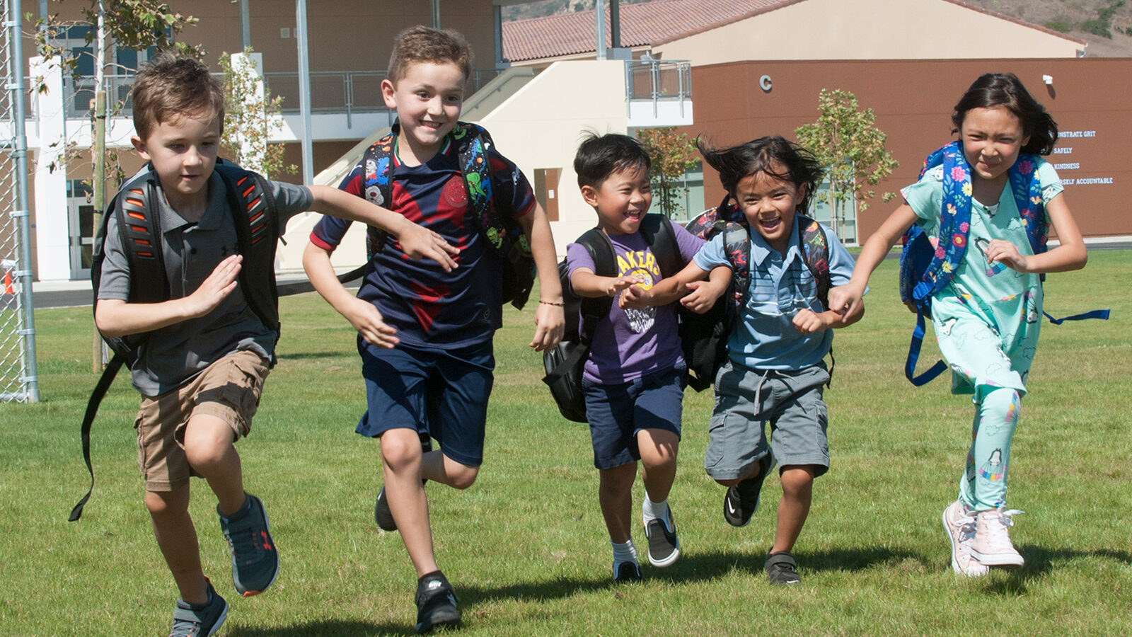 kids playing on school lawn